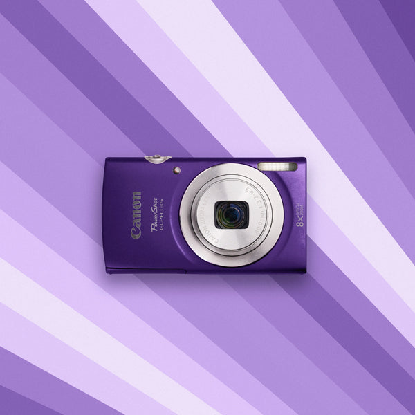 Purple Canon Canon Powershot ELPH 135 on a purple and white striped background
