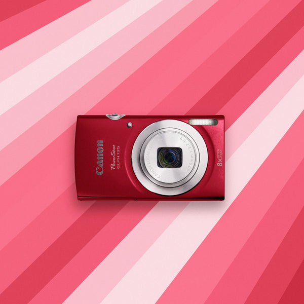 Red Canon Powershot ELPH 135 on a pink and white striped background