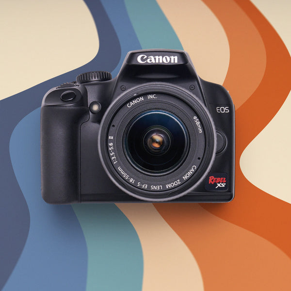 Canon Rebel XS on a colorful wavy background