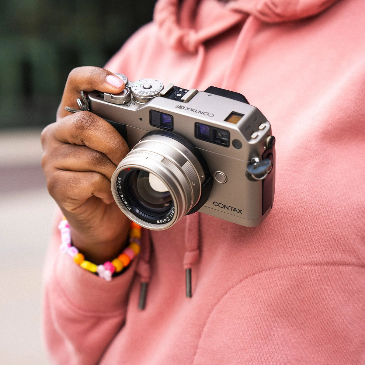woman holding the Contax G1 Rangefinder Film Camera