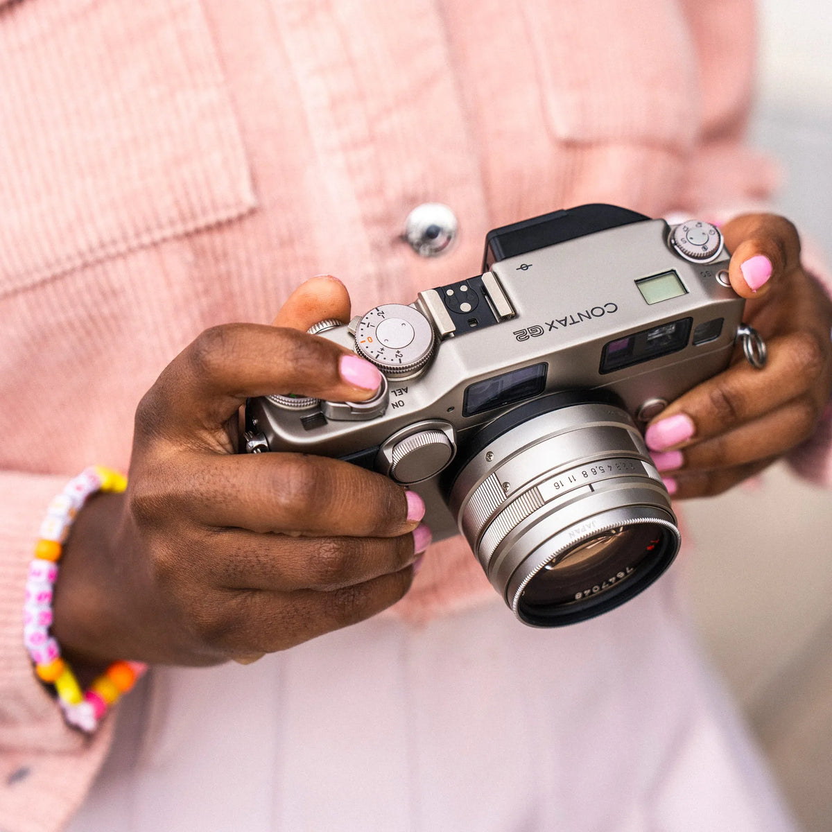 woman holding the Contax G2 35mm film camera