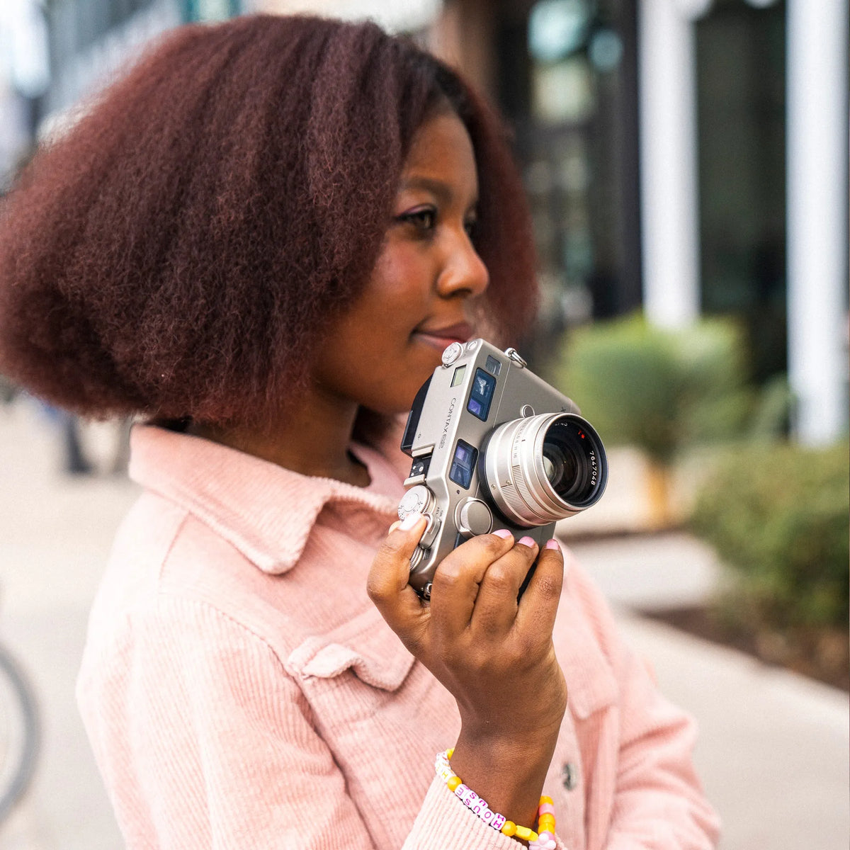 woman holding the Contax G2 35mm film camera