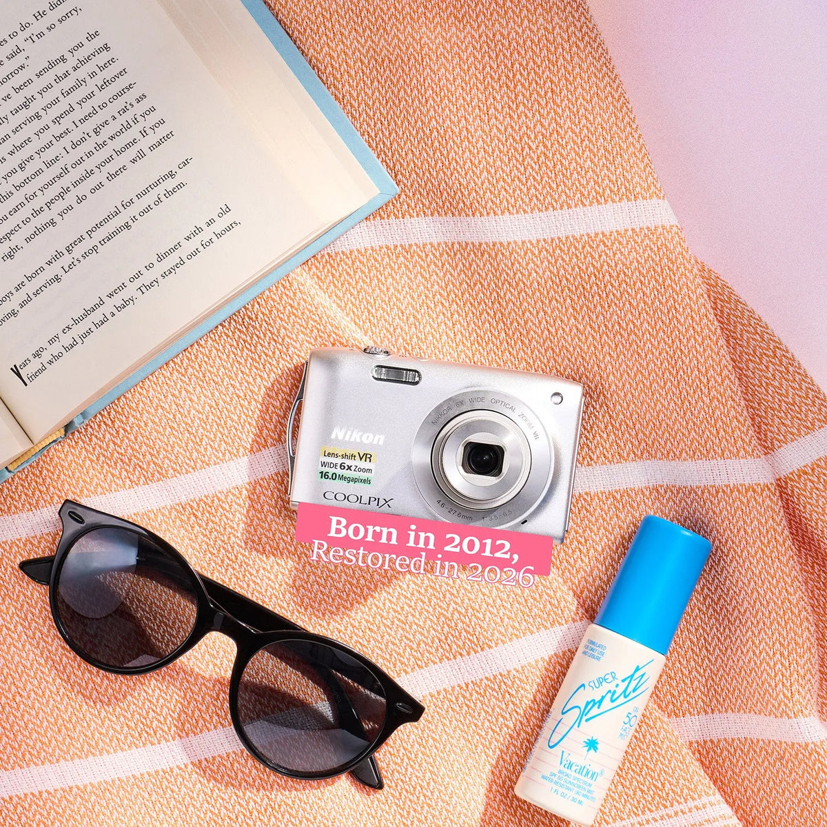 Restored Nikon COOLPIX S3300 styled with summer accessories and text reading “Born in 2012, Restored in 2026”