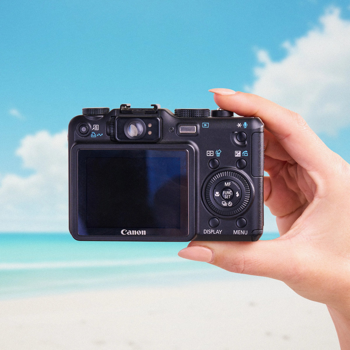 Back view of a Canon PowerShot G7 showing its LCD screen, optical viewfinder and controls