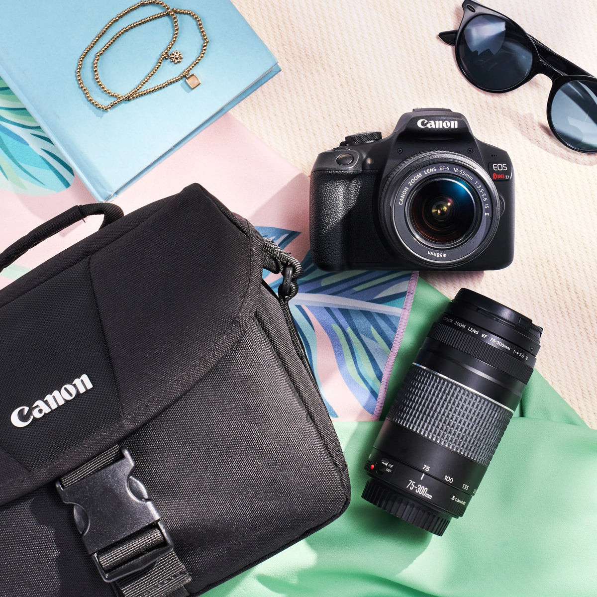 Canon Rebel T7 dual-lens kit arranged with a camera bag and colorful accessories