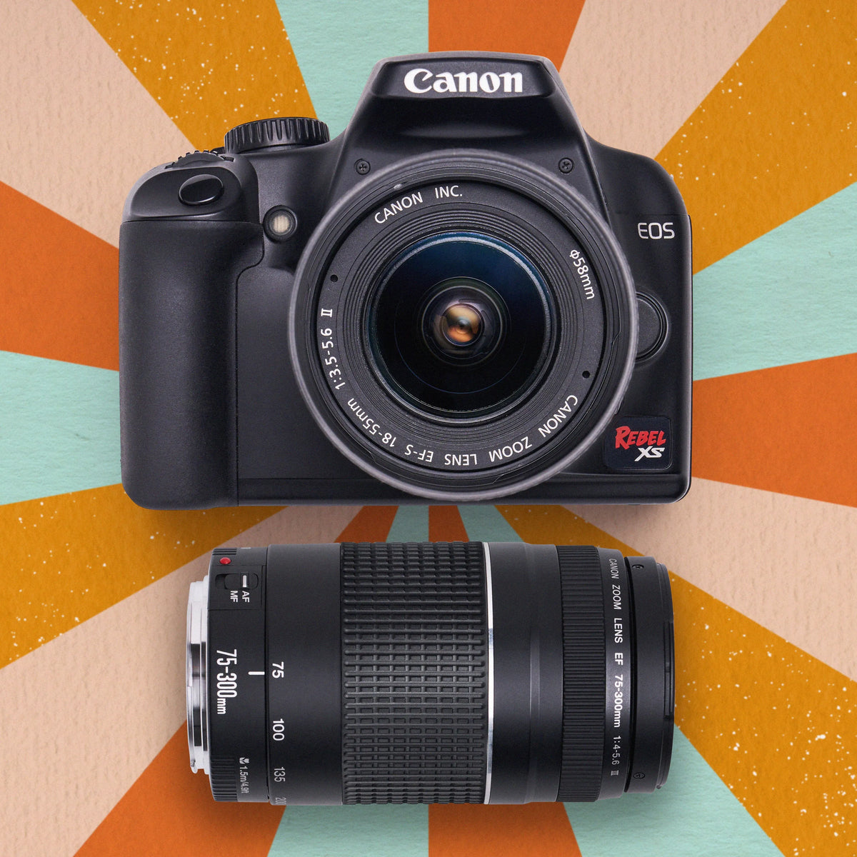 Canon DSLR camera with lens on a colorful geometric background