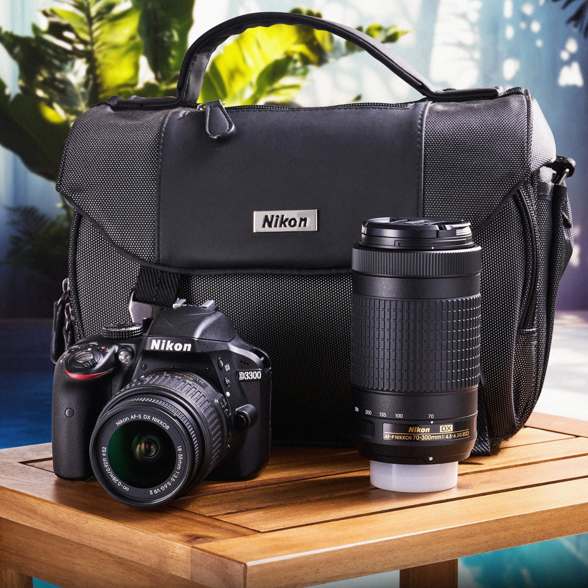 Nikon D3300 dual-lens camera kit with 18–55mm and 70–300mm lenses and a carrying bag