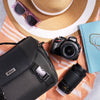 Nikon D5100 dual-lens kit with camera bag, DSLR body, two lenses, hat and sunglasses