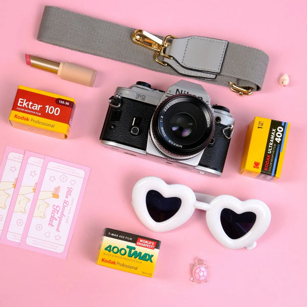 Nikon FG 35mm film camera kit with lens, film, strap and development passes