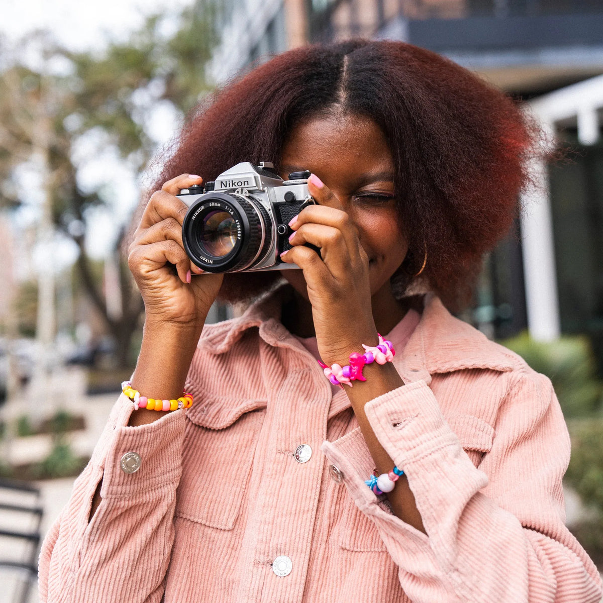 woman using a Nikon FE 35mm Film Camera