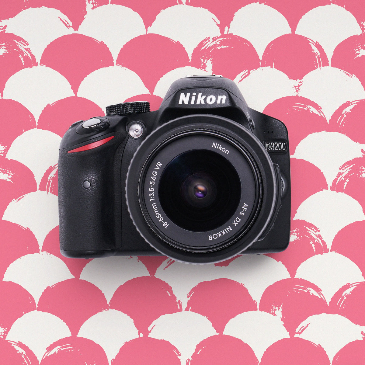 Nikon D3200 DSLR Camera on a pink and white patterned background