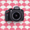 Nikon D3200 DSLR Camera on a pink and white patterned background