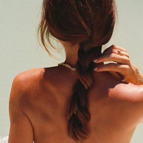 photograph of a woman's back using the Pentax ME Super 35mm Film Camera 