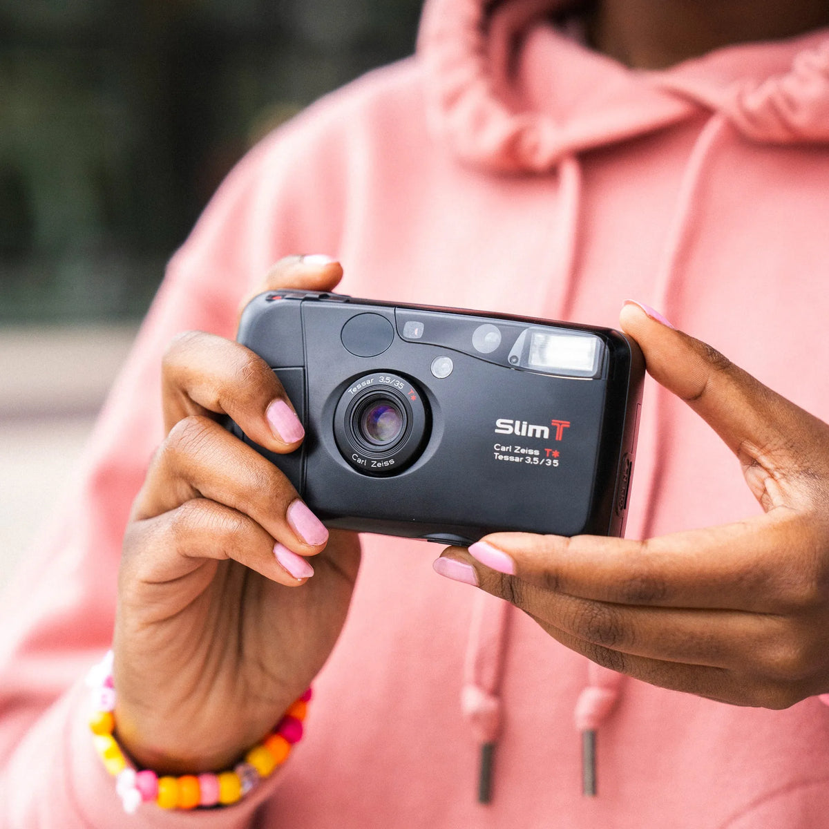 woman holding Yashica T4 35mm Film Camera