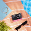 Restored Canon PowerShot S95 styled with poolside accessories, labeled Born in 2010, Restored in 2026