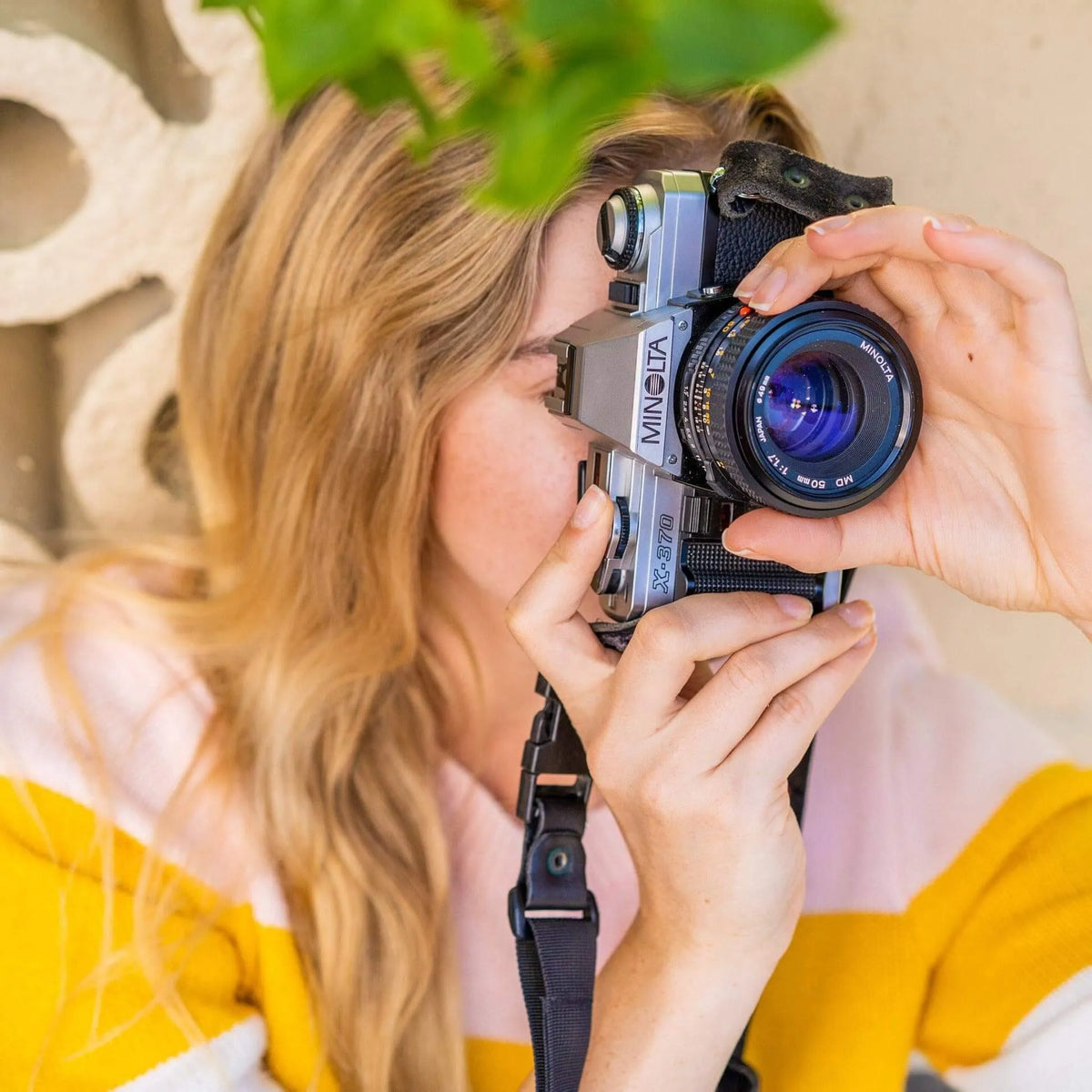 girl using the Minolta X-370 35mm film camera 