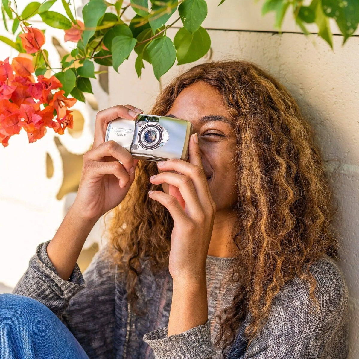 woman using the Olympus Stylus 120 35mm Point and Shoot Film Camera 